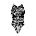 Costume da allenamento nuoto Boneswimmer per bambina, modello intero PINUP 412p con stampa di un teschio e scheletro bianchi su fondo nero in stile messicano e tribale, fronte