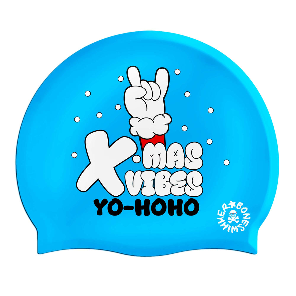 Una cuffia in silicone azzurra con scritte natalizie e la mano di Babbo Natale in un gesto cool; idee regalo Natale 2025 di Boneswimmer