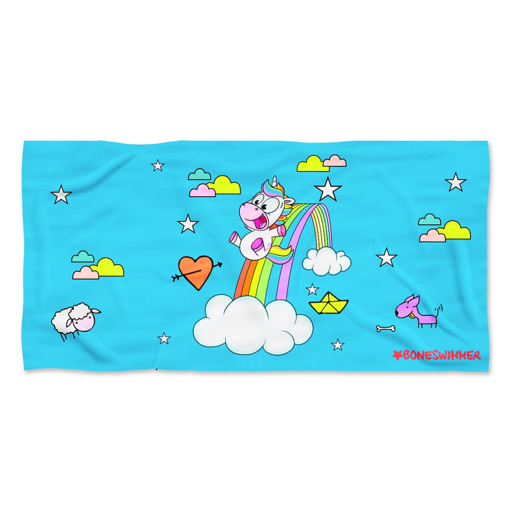 Telo mare piscina microfibra azzurro con unicorno su arcobaleno e nuvole.